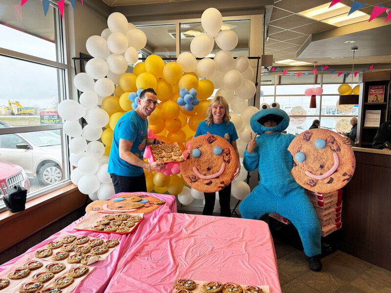 Tims Westman owners during Smile Cookie campaign