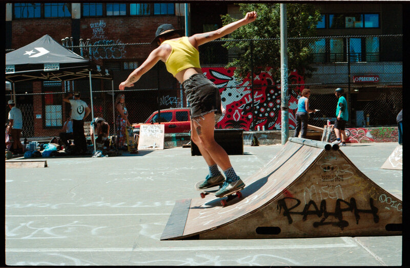 Film photo of skater girl in mid trick