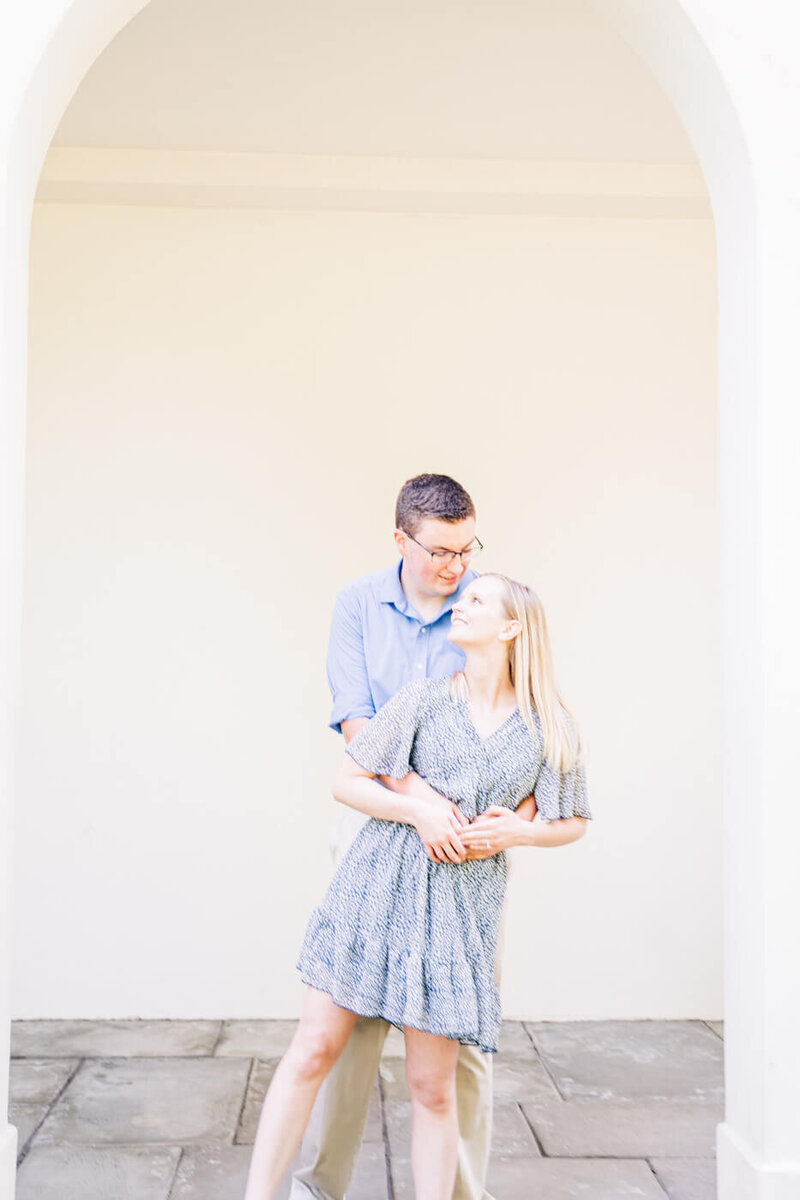 A couple dance together during their engagement photography session at an art museum in Cincinnati, Ohio.
