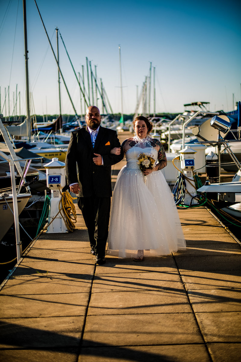 Couple poses on the transient dock at the Erie Yacht Club