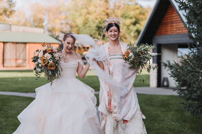two brides joyfulling celebrating after their wedding