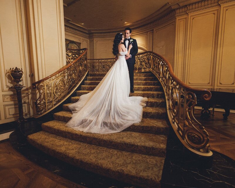 Bride and groom on the staircase at the Westgage hotel San Diego
