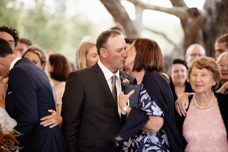 Couple kissing at Wedding