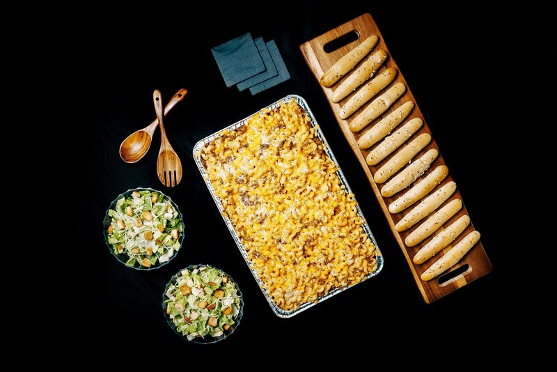 Delicious macaroni and cheese with salad and breadsticks made by utah caterers Crisp Catering