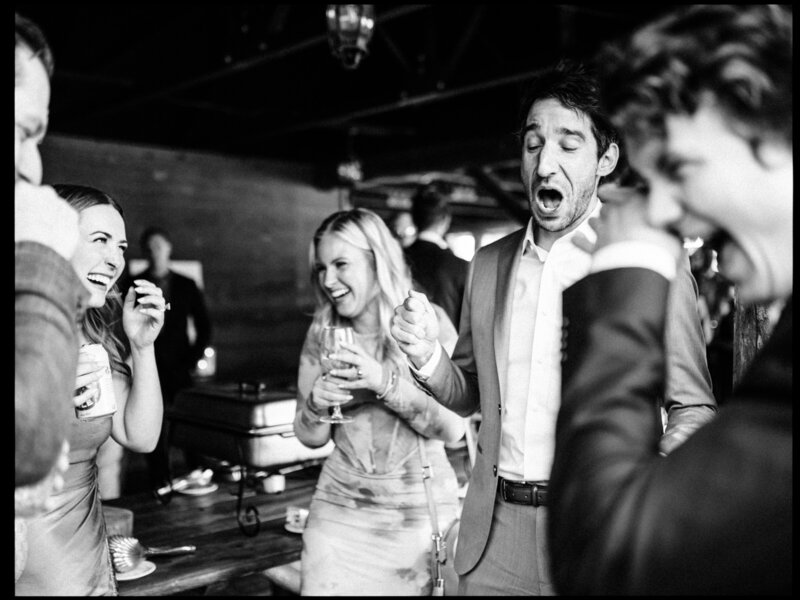 Bride and groom hold hands and smile together during wedding ceremony at Sunken Gardens in St. Petersburg, Florida.