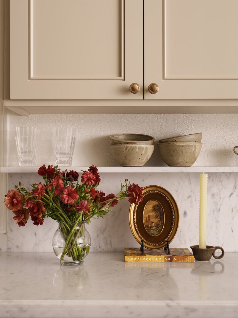 San Clemente kitchen remodel with tan painted shaker cabinets and marble countertop