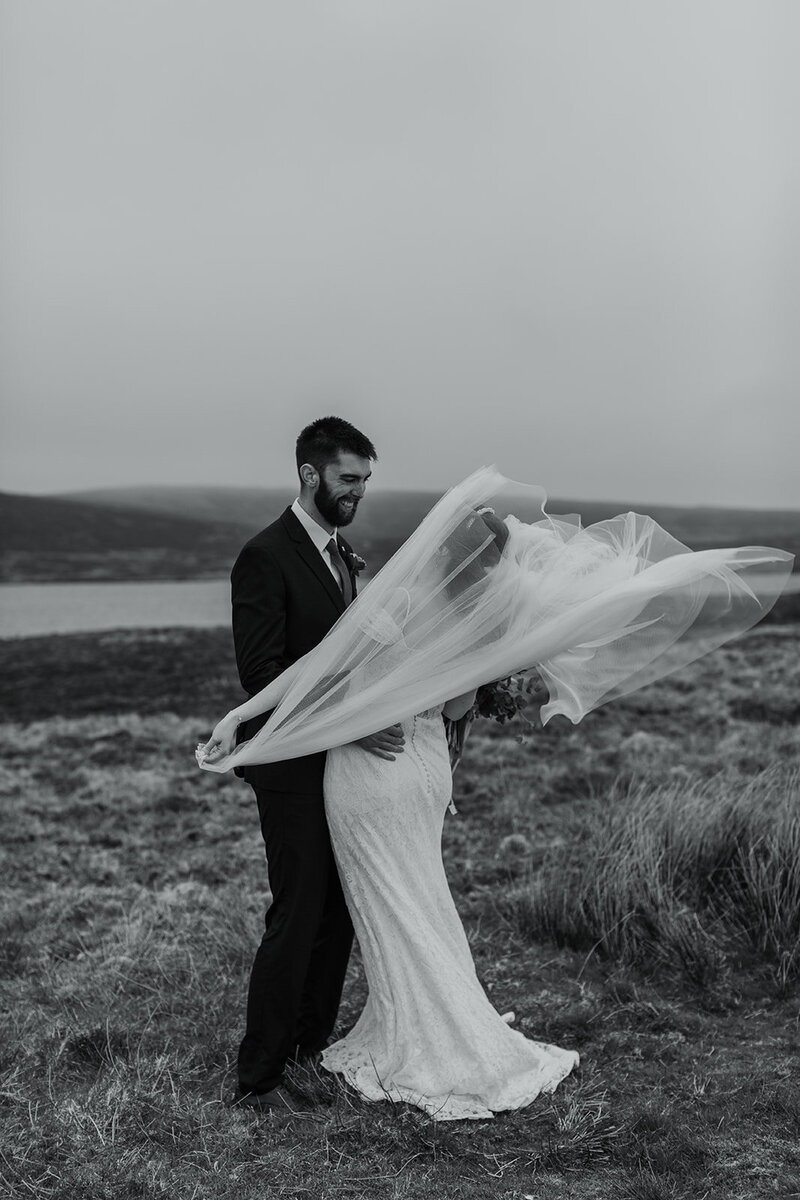 bride and groom in Scottish wind