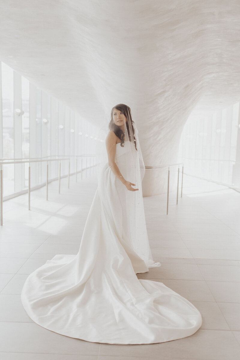 Bride in gown at a modern venue.