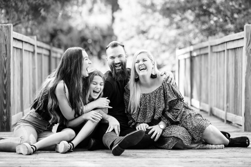 Family laughing together by Orlando portrait photographer