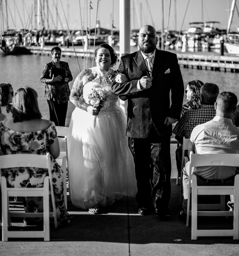 Recessional portrait of bride and groom after their Erie Yacht Club wedding