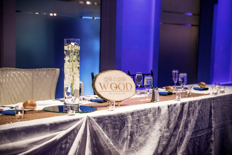 Couple's wood sign at their reception table placing