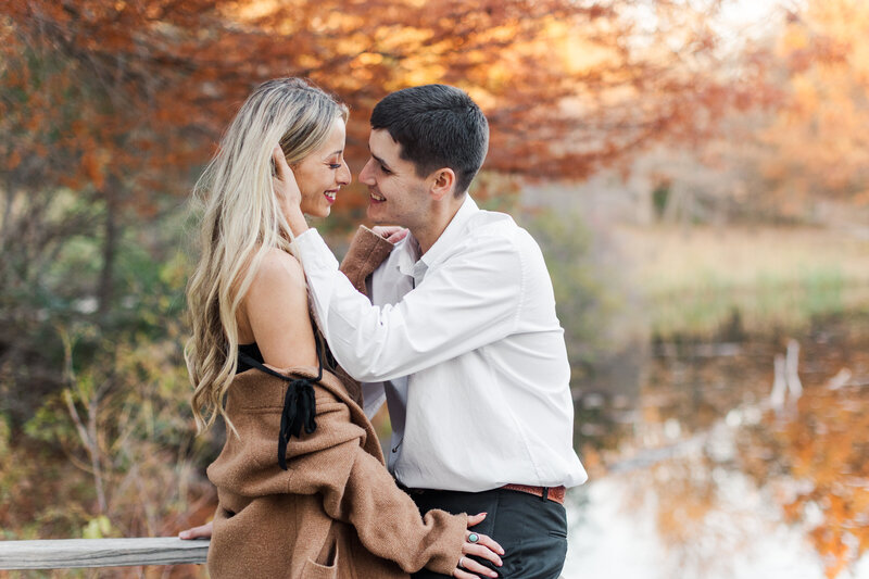 Colorful Fall engagement session by a pond at Gilcrease Museum in Tulsa, Oklahoma.
