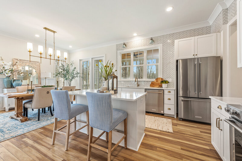 kitchen island seating. A residential new construction project in which Gracious Home Interiors designed and staged a new construction home in Mint Hill, NC, with Bridwell Homes.