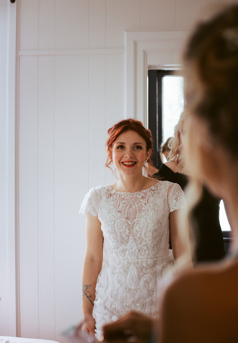 smiling bride in a white dress