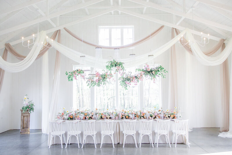 luxury table scape set up with orange and pink florals at magnolia hill farm in OH