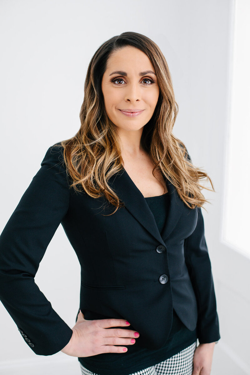 Professional business headshot of woman in a blazer