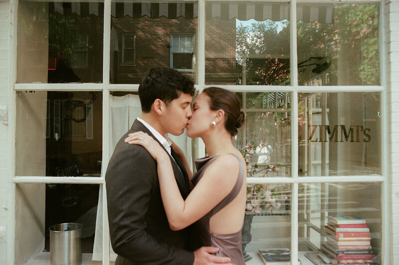A breathtaking, documentary-style photograph capturing an adventurous engagement session at Utah's Great Saltair. This image showcases the couple's joyful connection against the stunning, expansive landscape of the salt flats