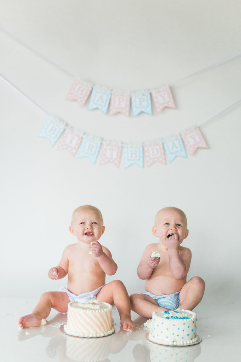 Studio one year portraits for twin boy and girl cake smash session