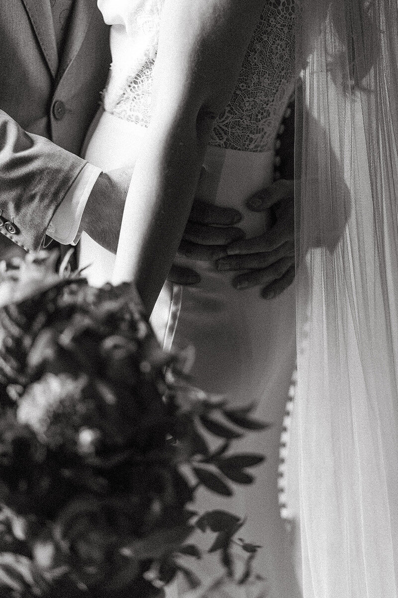 detail shot of bride and groom embracing after wedding in lancaster pa