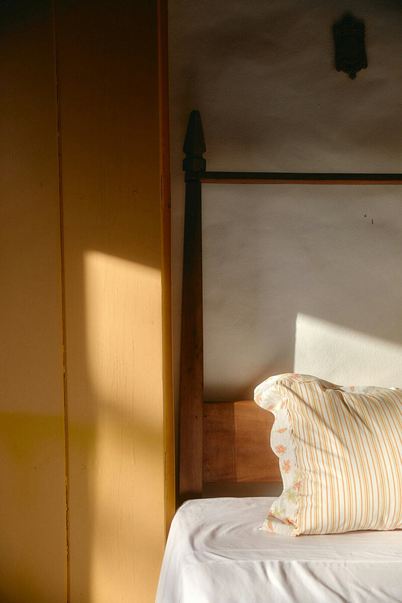 bed with yellow stripe pillow