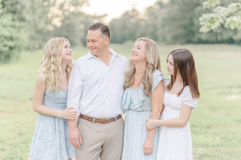 family laughing during spring mini session taken by a Fairfax County, VA photographer