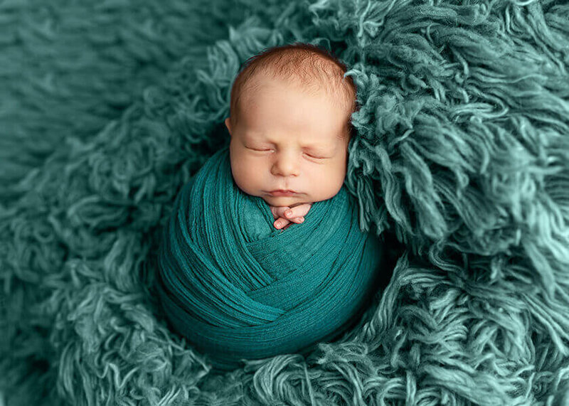 Baby wrapped in a bowl