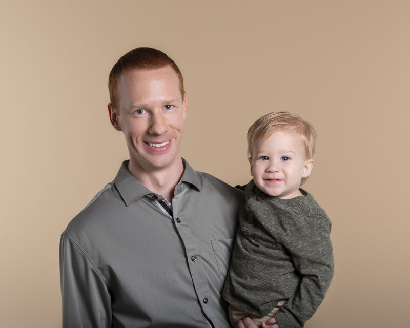 charlotte dad and young son smiling at the camera created in fort mill sc portrait studio