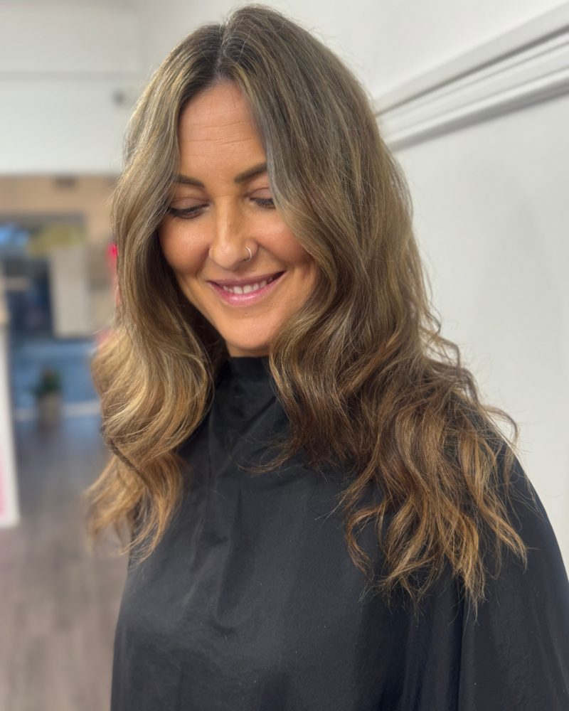 smiling client after hair service