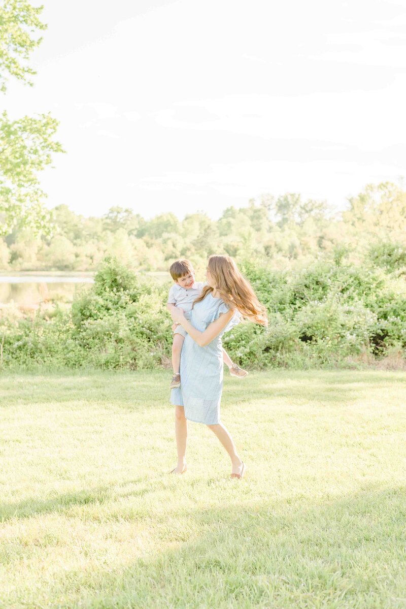 Mom twirling boy son during Prince William County, VA pictures
