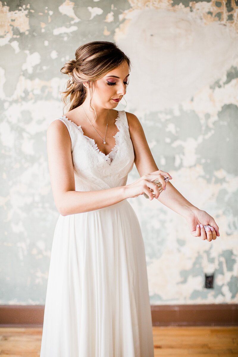 spraying perfume by Knoxville Wedding Photographer, Amanda May Photos