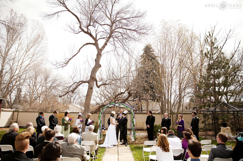 Backyard wedding at the McCreery House wedding venue historic french mansard roof victorian home in Colorado