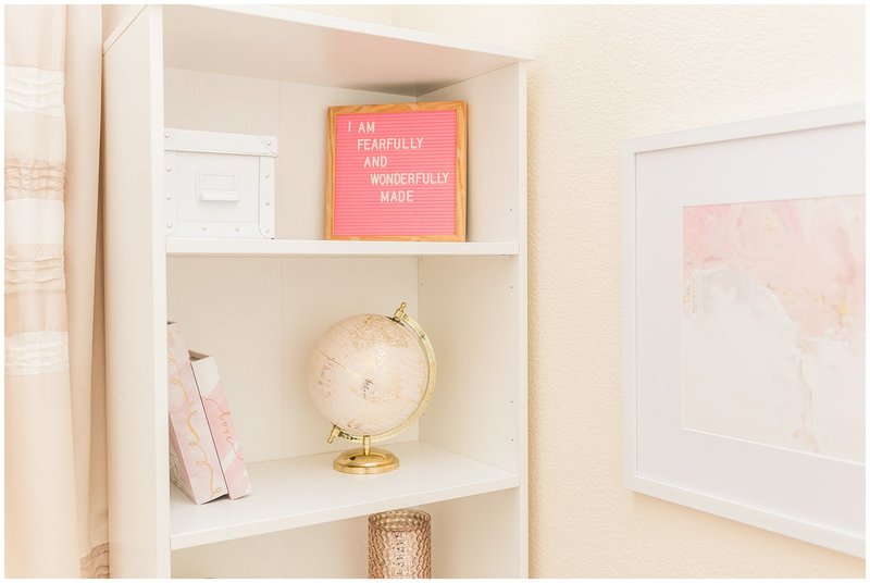 Ikea book shelf | book shelf decorated with pink and gold globe, letterboard, books, and vase