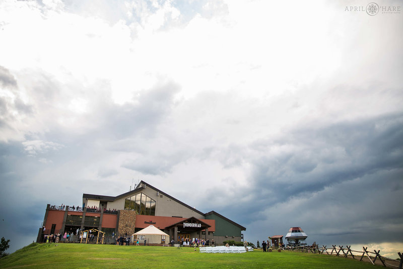 View of Thunderhead Lodge as a summer storm rolls in on a summer wedding day at Steamboat Springs Ski Resort