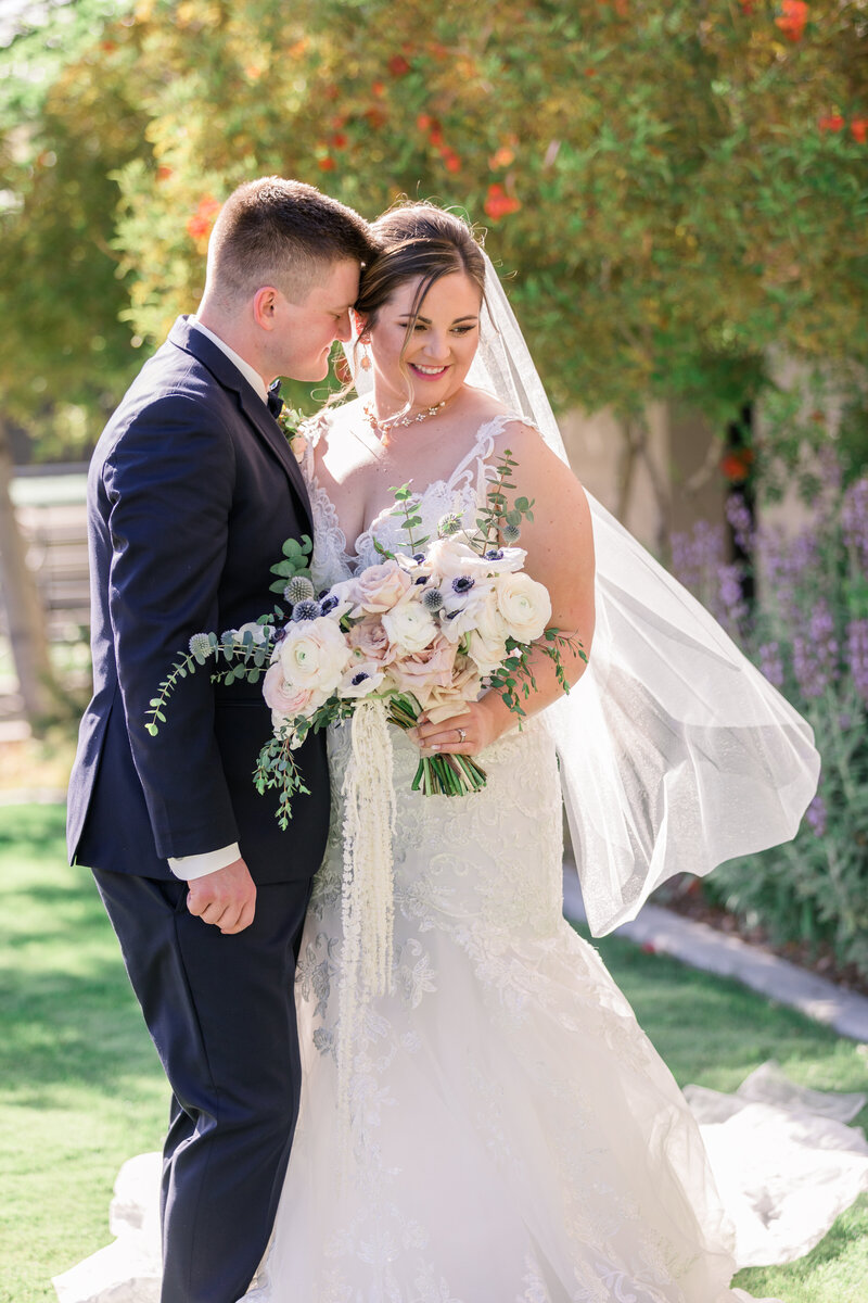 Bride and groom smile on wedding day at Skyline Country Club Wedding