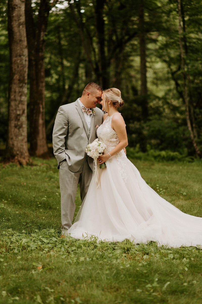 forest elopement at great falls park in northern virginia with luscious greenery and tall trees surrounding their private first look
