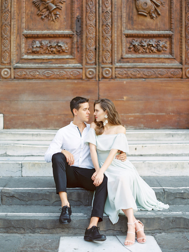 Florence Italy engagement session sitting on the steps of the duomo