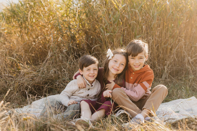 Children hugging for their portrait session in Seattle