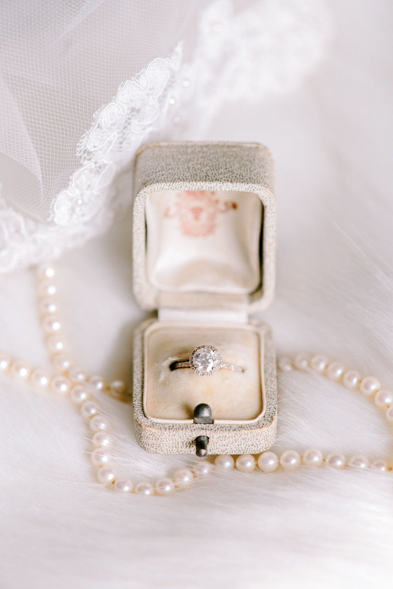 engagement ring in vintage ring box with pearls