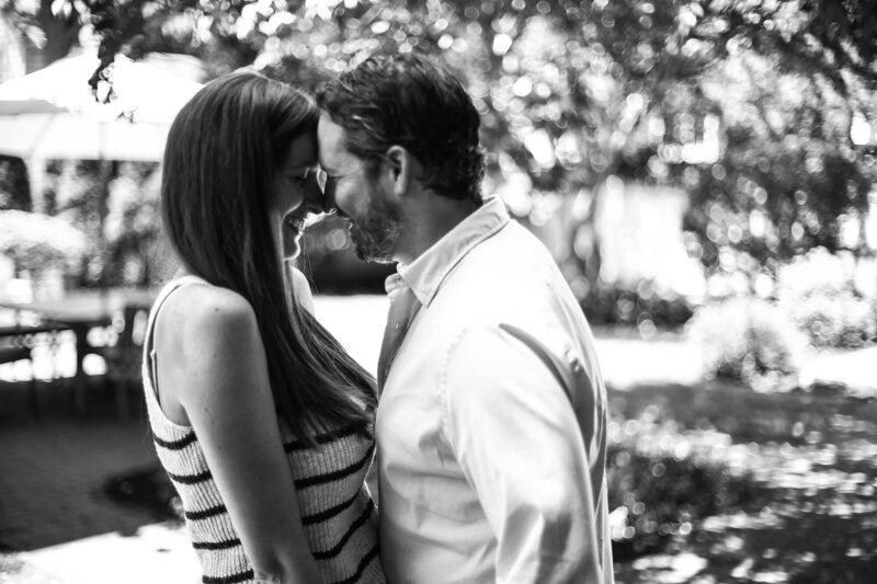 couple touches foreheads during engagement photos