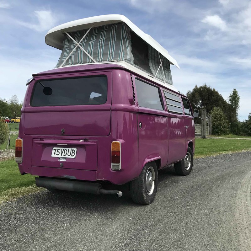 Outside view of pop top extended of Pippi, purple retro kombi van from NZ Kombi Hire