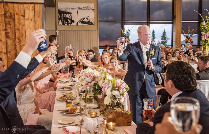 Father of bride gives fun toast inside Champagne Powder Room at Steamboat Resort