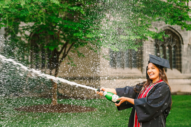 Champagne popping at a UChicago graduation photoshoot