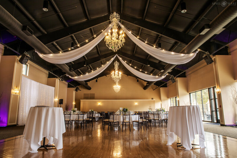 View of the interior of the large modern ballroom set up for a small wedding at Wedgewood Weddings Black Forest