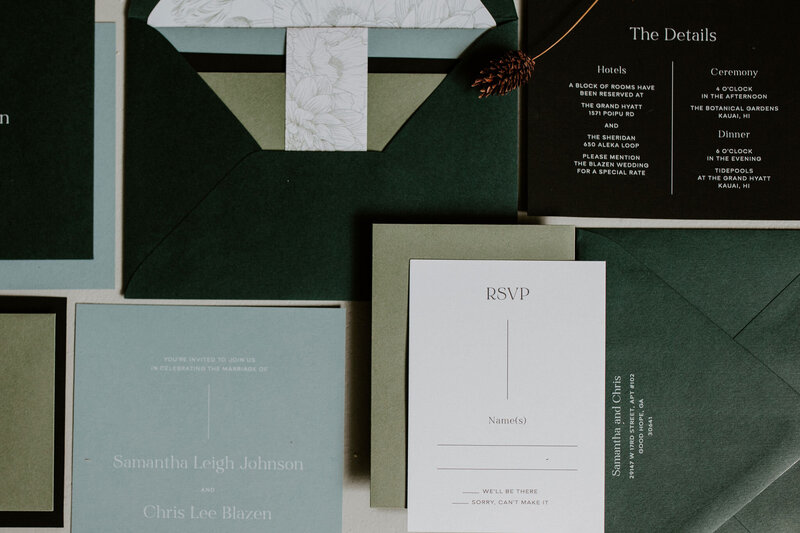 Modern black wedding invitation with dark green and blue envelopes