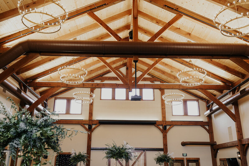 a rustic chandelier in the barn at barnwood events, a wedding venue in madison, winconsin.