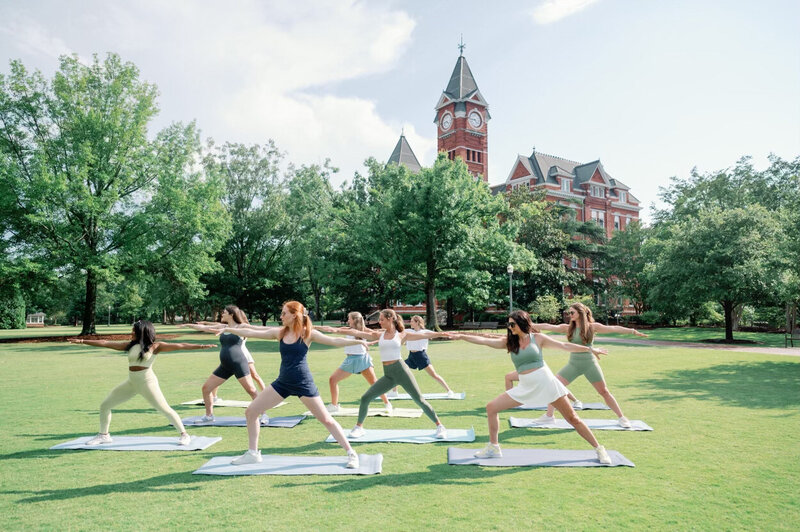 Women completing workout class on Auburn University campus
