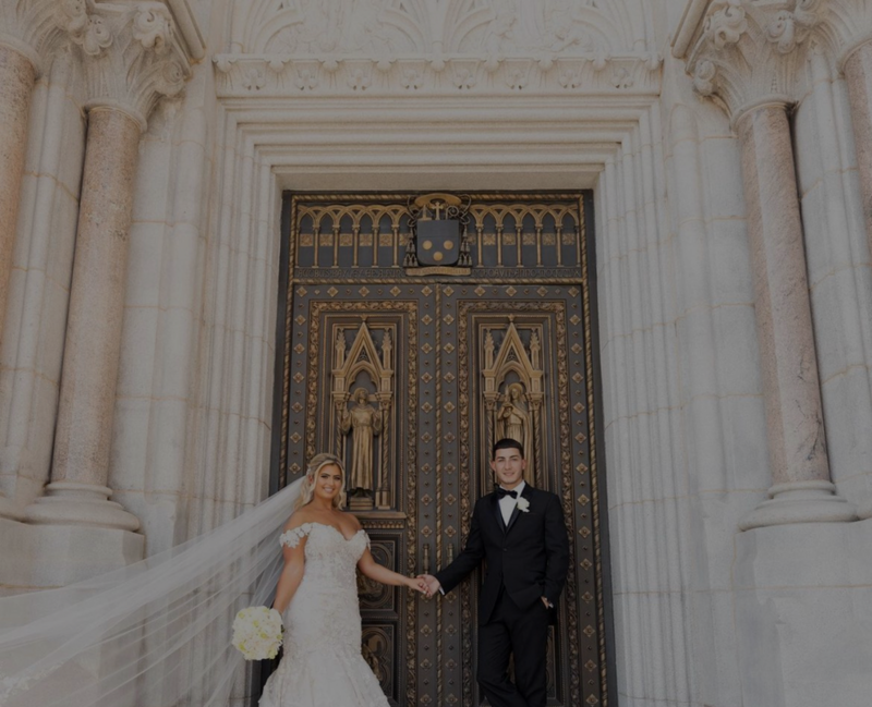bride and groom standing at door