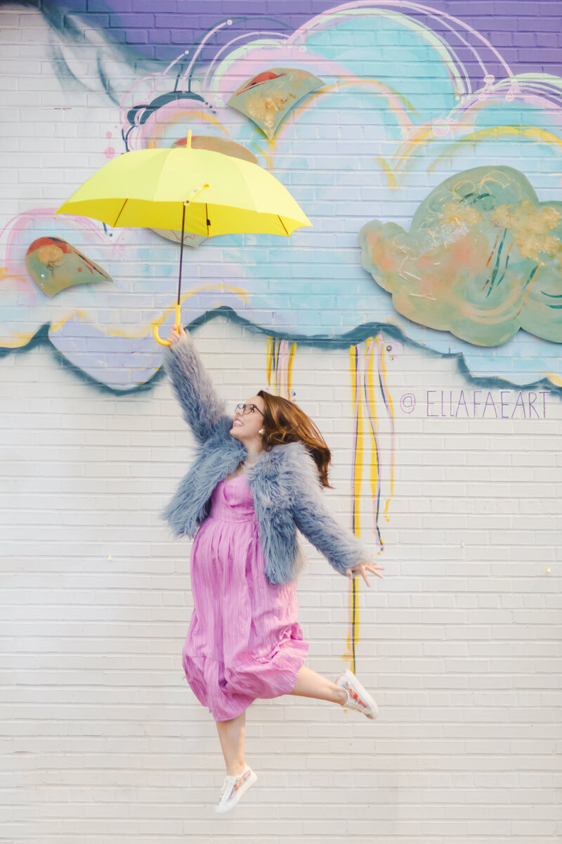 Woman Jumping with Umbrella