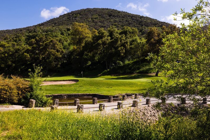 Bridge, mountain, greenery, and grounds at Vista Valley Country Club in San Diego.