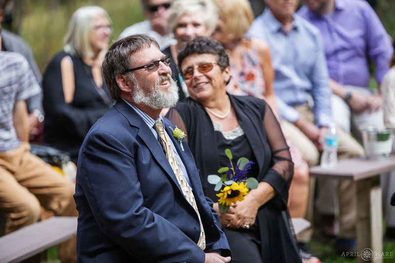 Guests-on-Benches-at-Outdoor-Colorado-Mountain-Ceremony-at-Beaver-Ranch